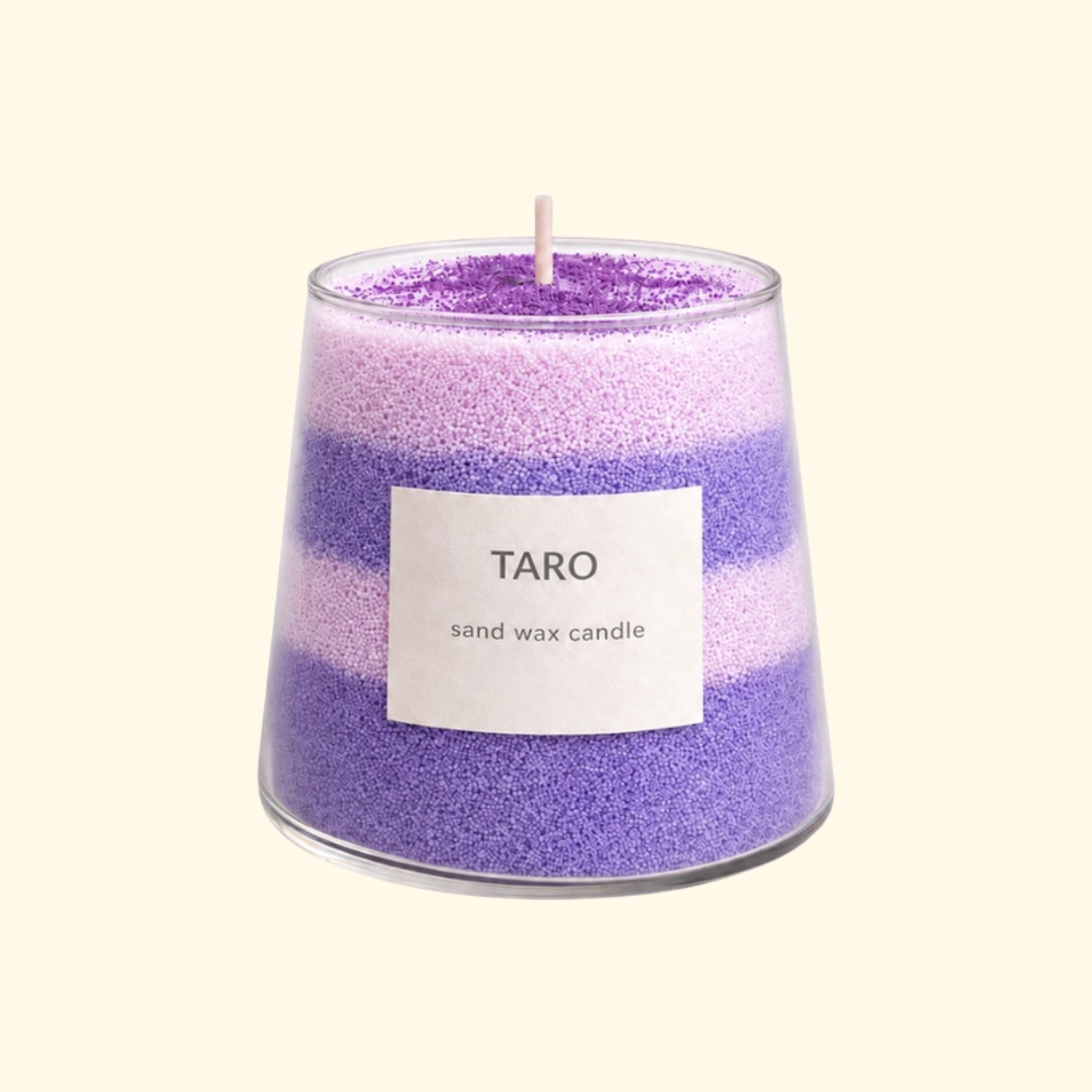 Finished Taro Dream sand candle made with the Aurea Nova candle making kit, featuring layered purple and white sand wax.