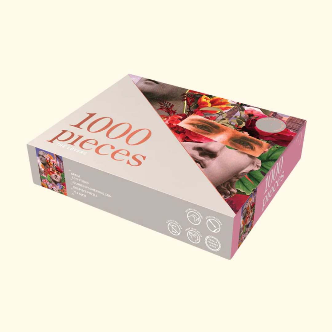 Packaging for The Lovers 1000 piece puzzle by Journey of Something featuring bold collage artwork and pink box design.