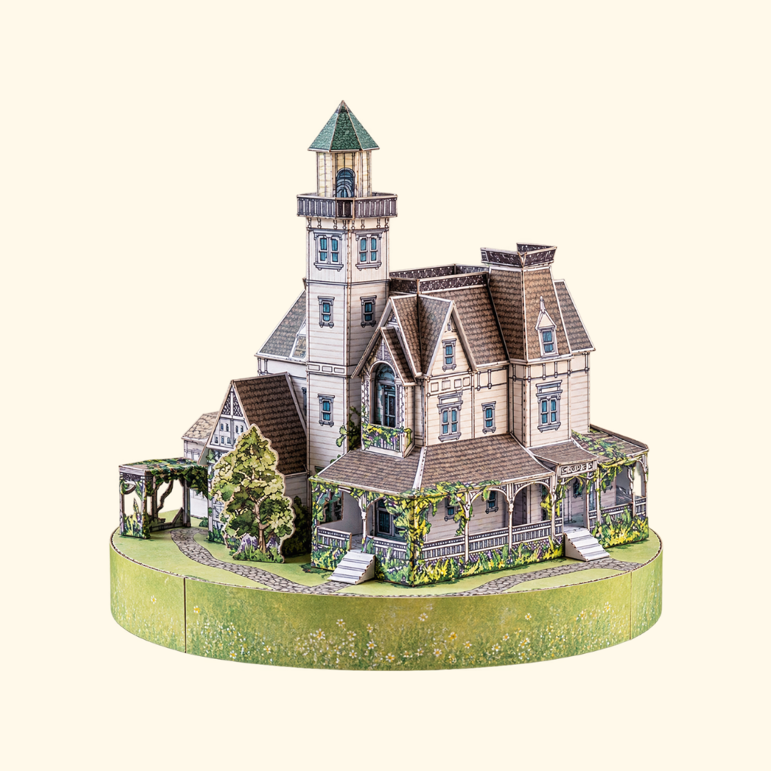 Completed Owens House paper model kit by Kiko Ilustrador, featuring the iconic Victorian house from Practical Magic with its detailed rooflines, turrets and garden.