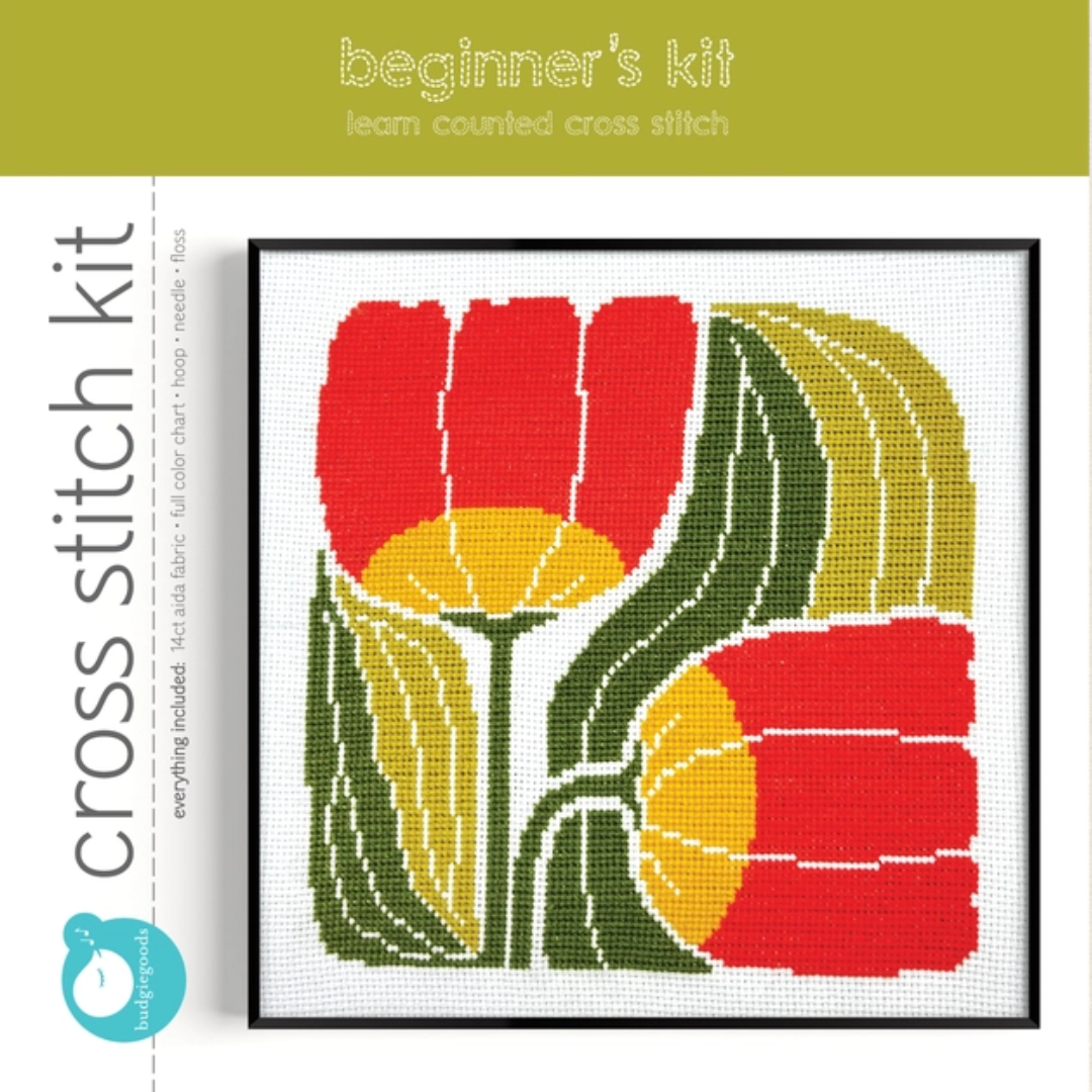 Twin Blooms Grid Cross Stitch Kit by Budgiegoods in its original packaging featuring the completed floral design.