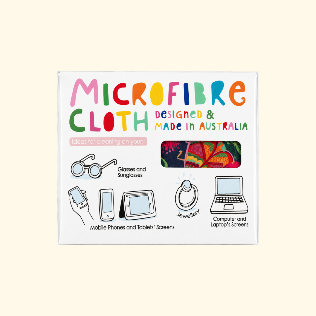 A square white product box for Microfibre Cloth, featuring colorful text and simple line drawings showing how to clean screens, glasses, jewelry, and a laptop. The box is photographed against a plain light beige background. Maker is Missy Minzy. 
