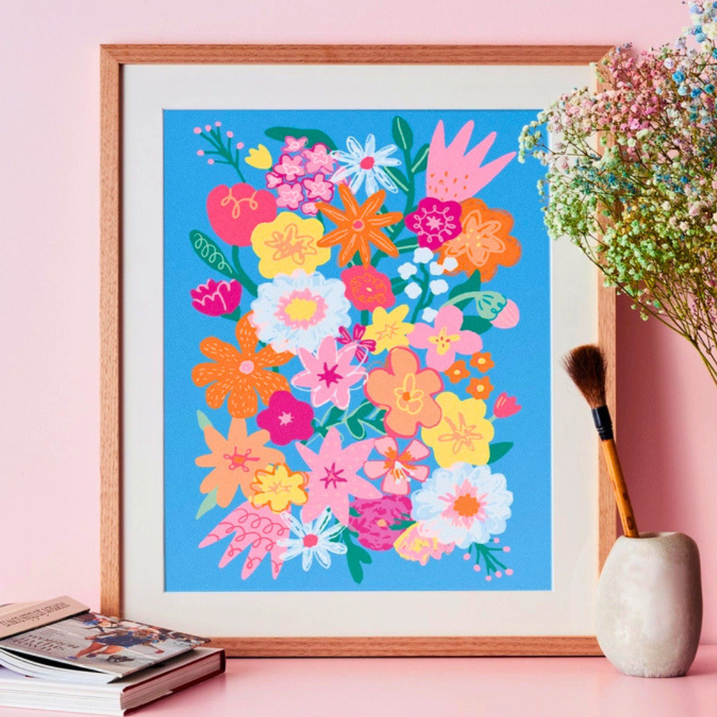Framed Wildflowers Paint By Numbers artwork displayed as colourful wall décor in a styled home setting.