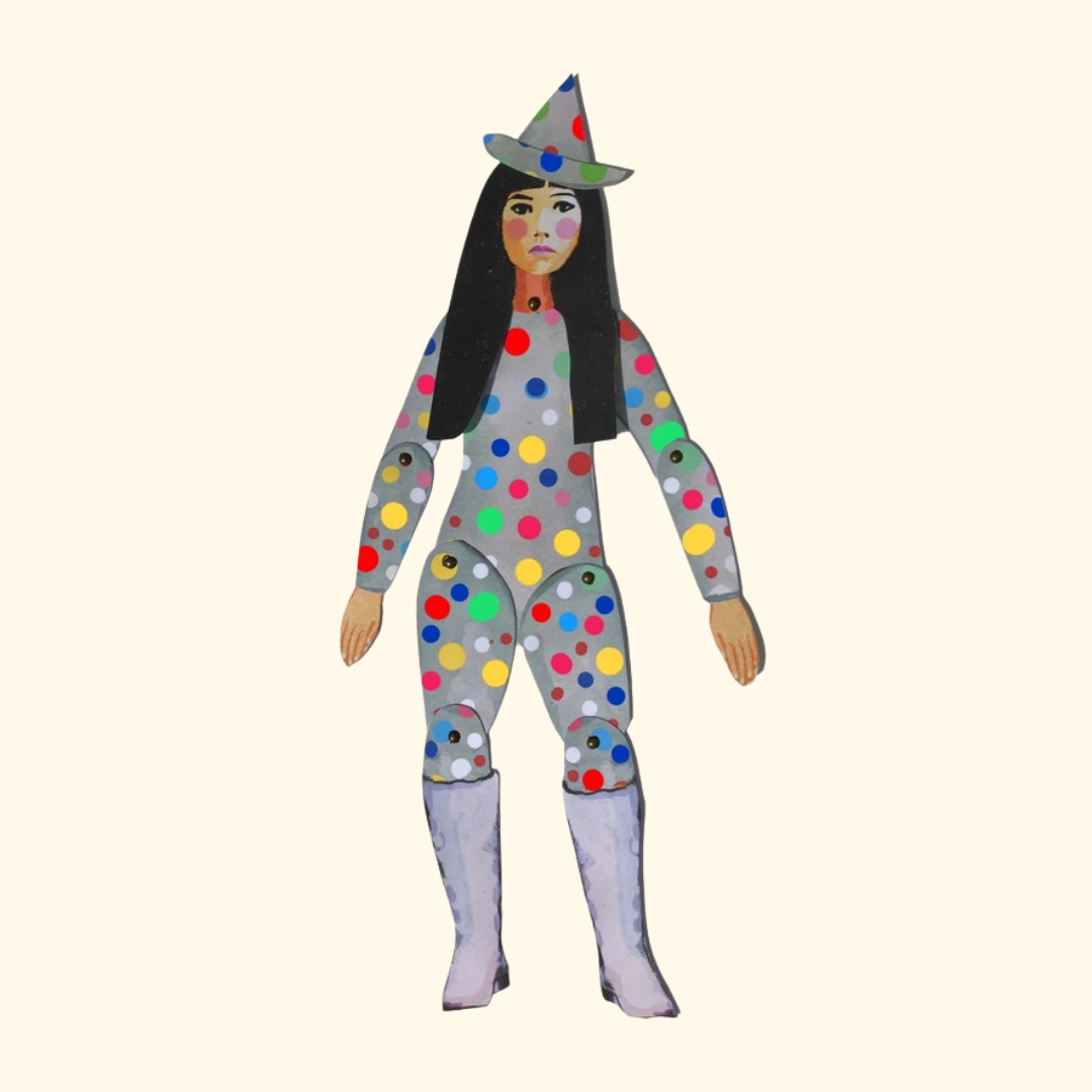 Finished Yayoi Kusama articulated paper puppet from the Wini Tapp Cut & Make craft kit